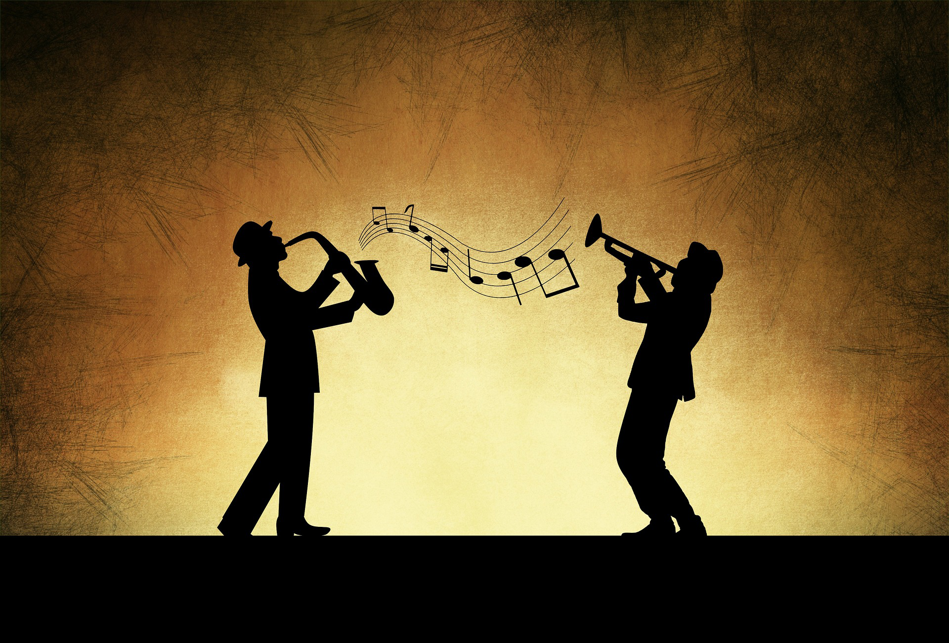 Two jazz musician silhouttes playing music. One has a trumpet, and the other has a saxophone. Image source Pixabay.