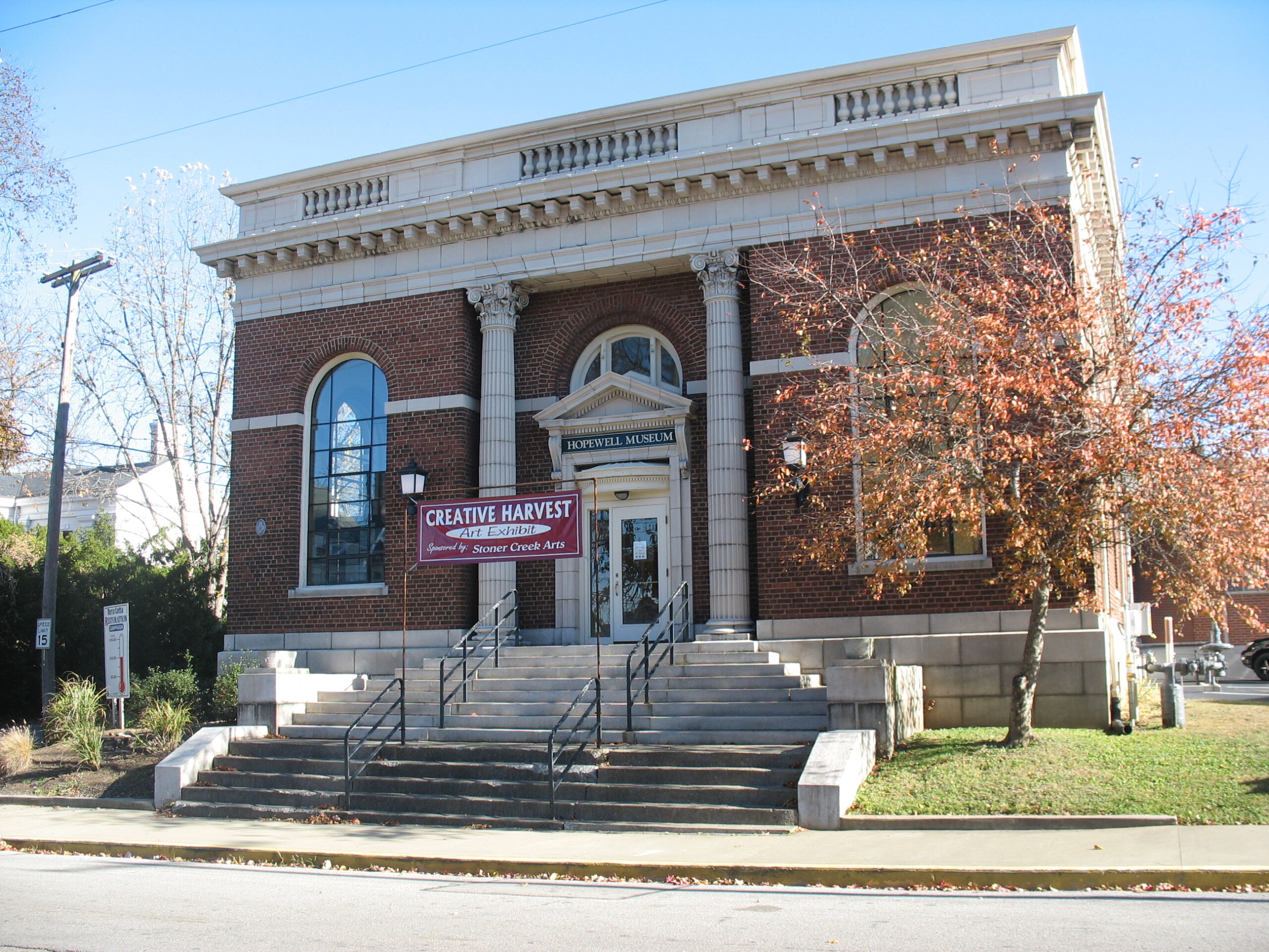 Front of Hopewell Museum with Creative Harvest banner across the front above the stairs.