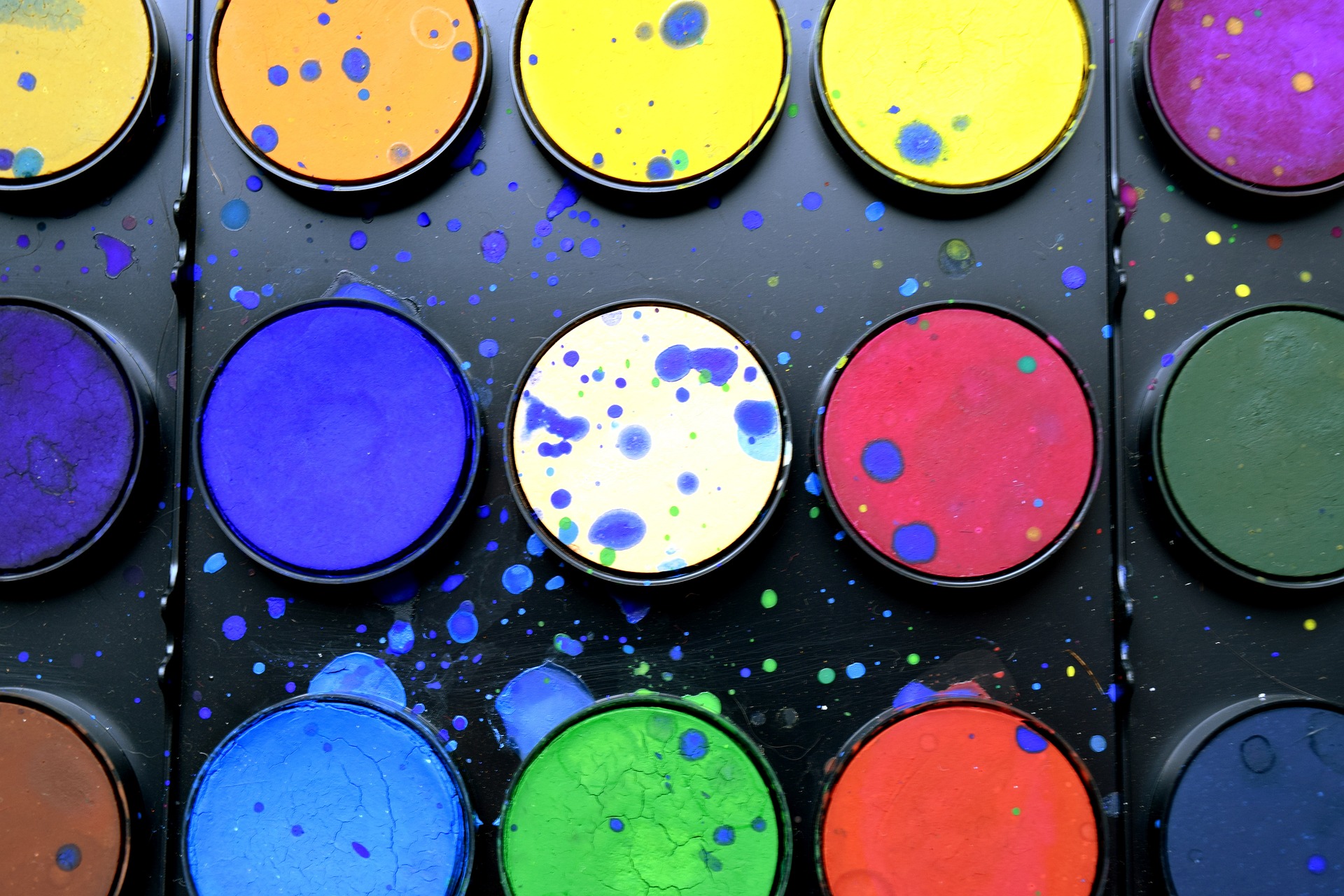 image of mutiple colors of paint in a palette