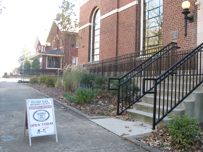 Welcome sign outside of side entrance to museum